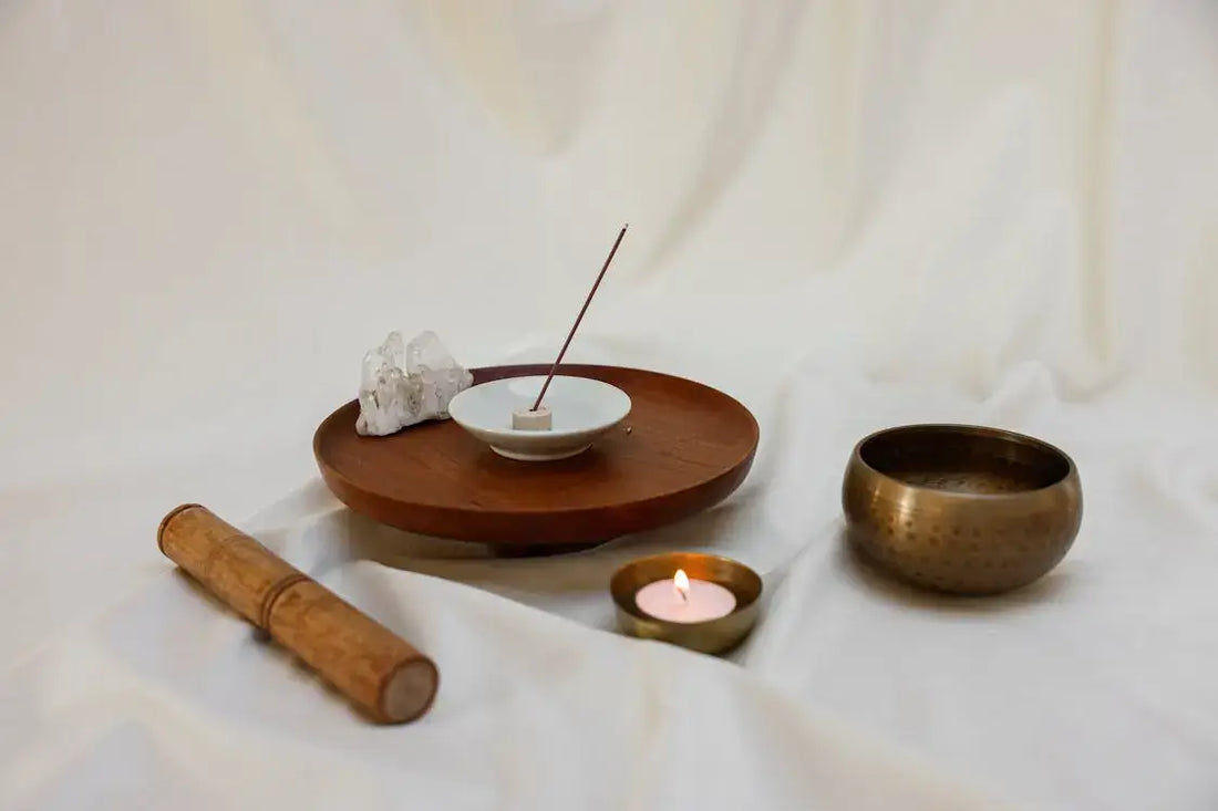 Person practicing singing bowl meditation for stress relief