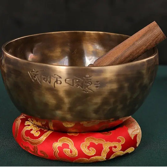 A calm meditation setup with cushion and singing bowl